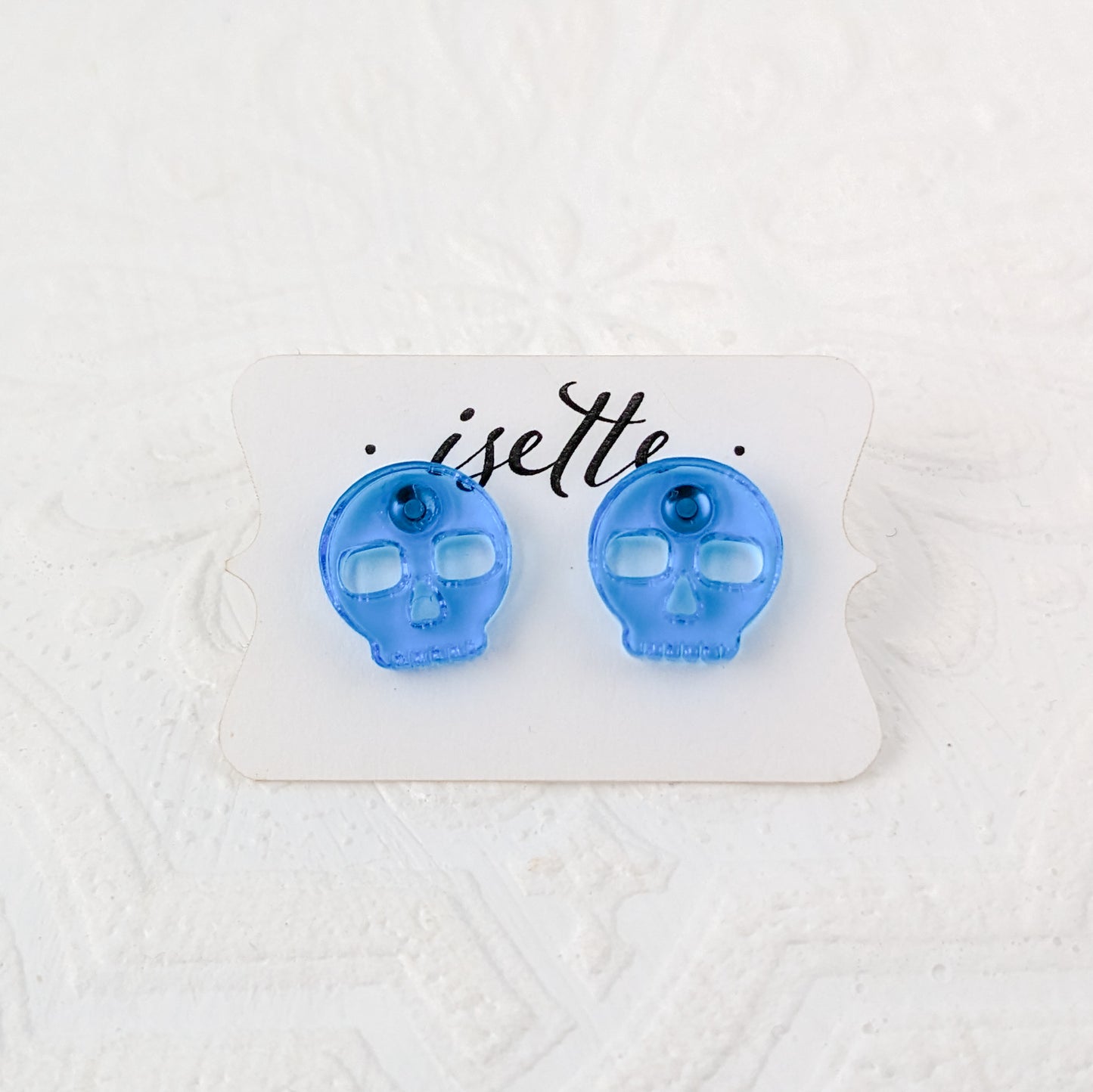 Skulls Studs, Transparent Blue