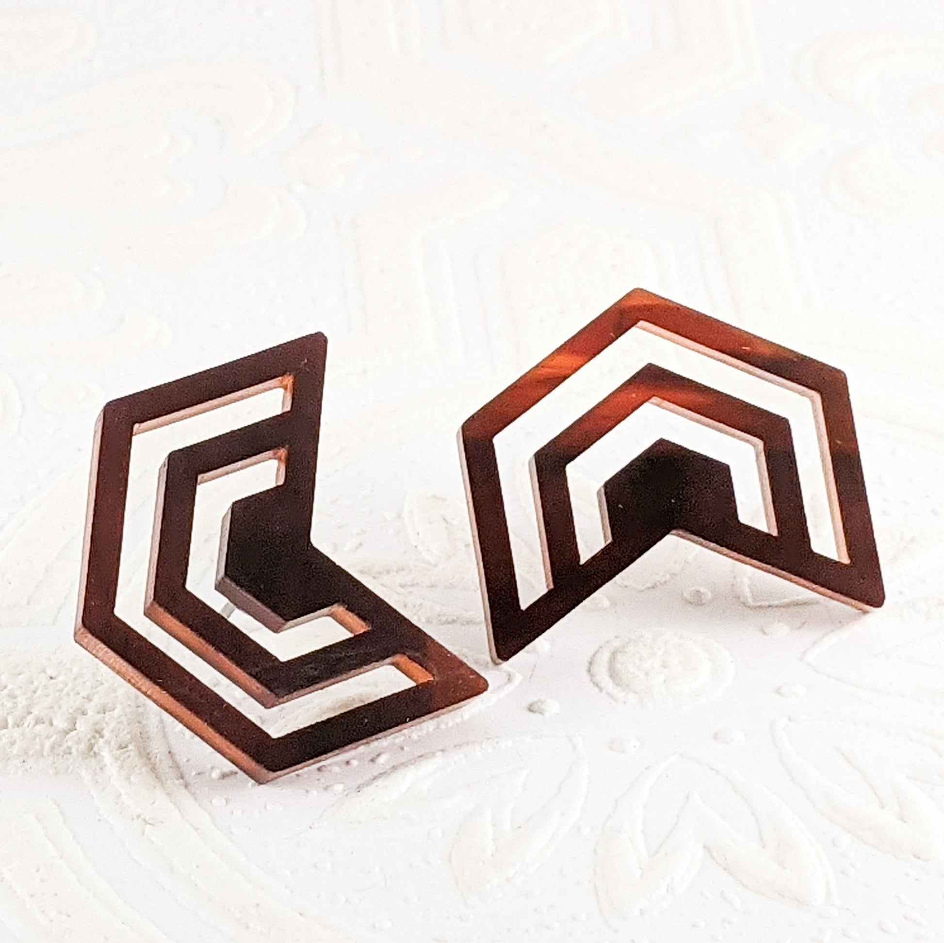 Warm translucent brown and gold tortoiseshell acrylic cut into Irregular Radiating Hexagon Earrings by Isette
