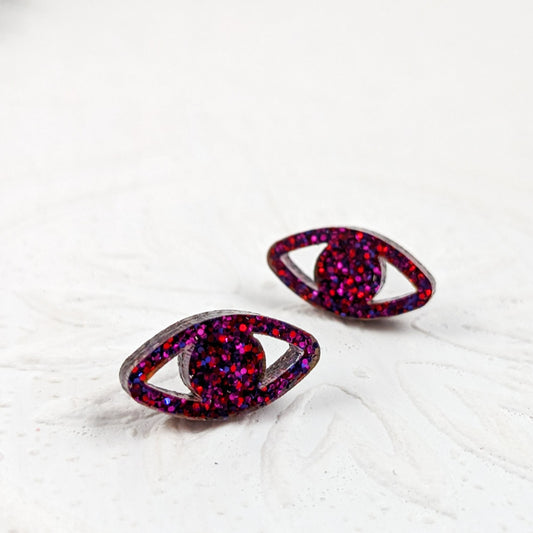 Eye shaped stud earrings made with ruby sparkle acrylic and stainless steel posts