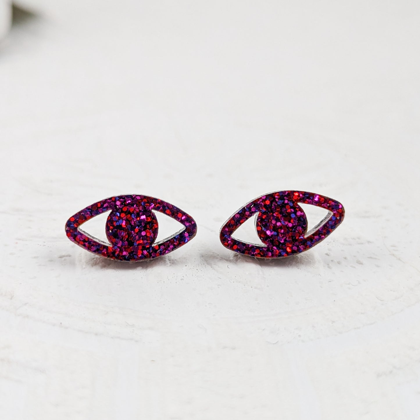 Peepers - Eye shaped stud earrings made with ruby sparkle acrylic and stainless steel posts