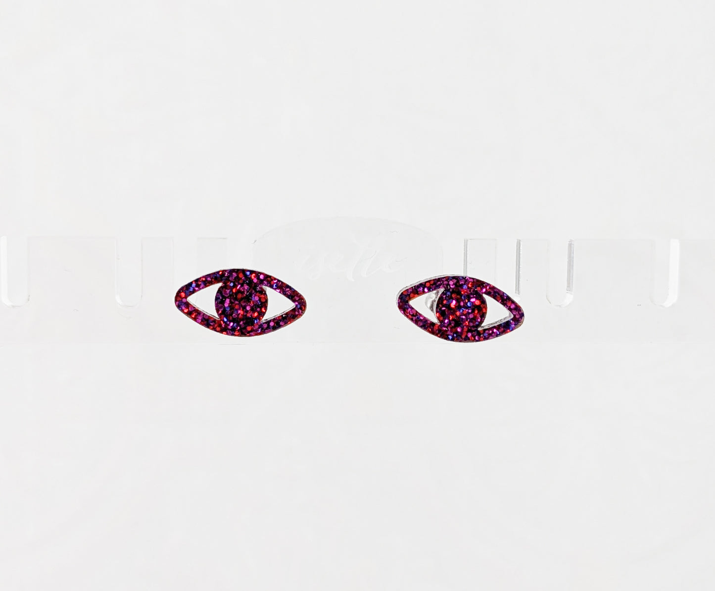 Peepers - Eye shaped stud earrings made with ruby sparkle acrylic and stainless steel posts floating